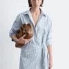 Vestido mini tipo camisa cruzada